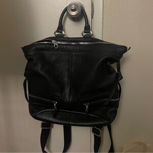 black Oryany pebbled leather backpack with silver hardware